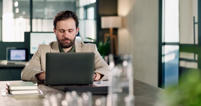 Corporate, man and reading in office with laptop, research and data analysis for finance report. Serious, male person or review in workplace with pc, financial audit and statistics for company profit