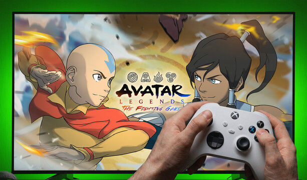 Avatar Legends The Fighting Game Title Screen Displayed on TV with Xbox Controller Held in Hands Showing Aang and Korra