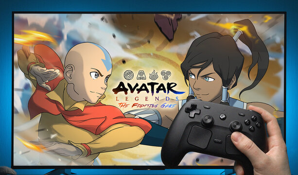 Avatar Legends The Fighting Game Title Screen Displayed on TV with Steam Controller Held in Hand Showing Aang and Korra