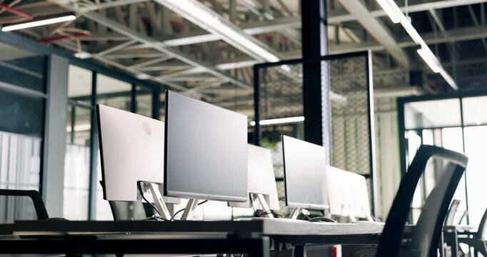 Office, equipment and computer with empty space for company startup or business operations. Chairs, technology or screens in workplace for design, development or job opportunity in corporate building