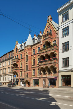 Historic Neo-Gothic red brick building facade at 17 Krisjana Valdemara Street in Riga, Latvia.