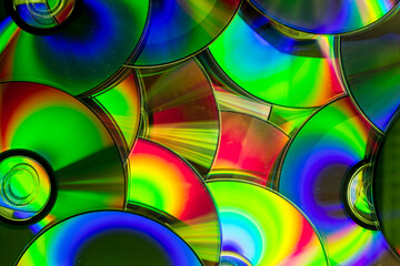 Reflection of the surface of a DVD discs with artistic lighting close-up © Roberto Sorin
