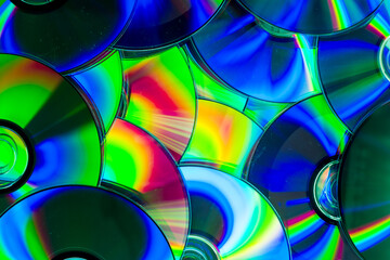 Reflection of the surface of a DVD discs with artistic lighting close-up © Roberto Sorin