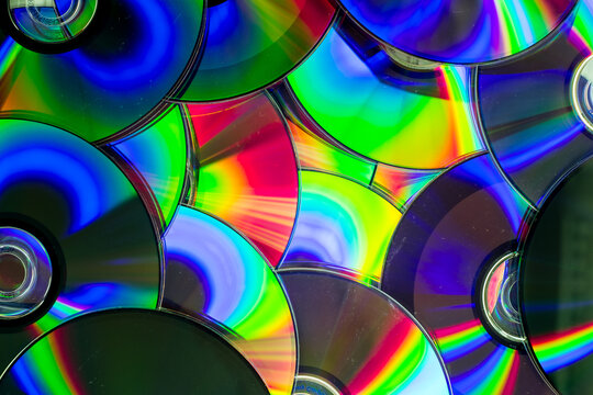Reflection of the surface of a DVD discs with artistic lighting close-up