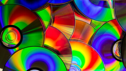Reflection of the surface of a DVD discs with artistic lighting close-up © Roberto Sorin