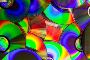 Reflection of the surface of a DVD discs with artistic lighting close-up © Roberto Sorin