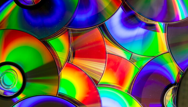 Reflection of the surface of a DVD discs with artistic lighting close-up