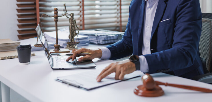 Lawyer working on laptop in law office