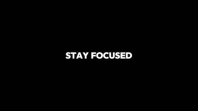 Stay focused motivational text animation displaying clean white typography on a deep black background for professional digital video footage content