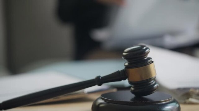 Judge&rsquo;s Gavel on Legal Documents Representing Justice, Law, and Court Proceedings