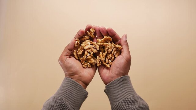 Holding walnuts in hands for healthy snack