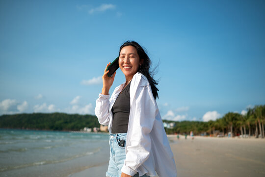 Carefree traveler feeling secure and protected while enjoying a dream vacation at a tropical beach