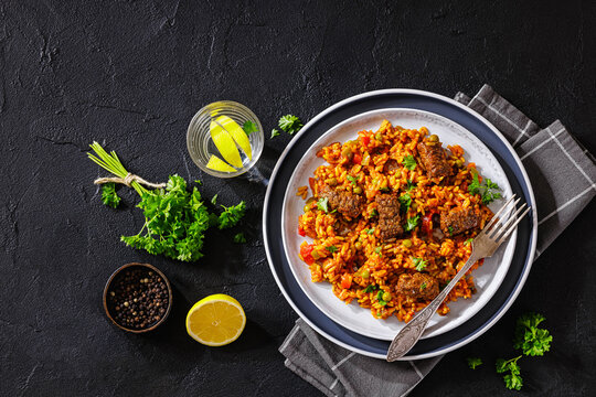 Greek Giouvetsi Rice Platter with Savory Biftekia