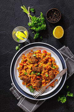 Greek Giouvetsi Rice Platter with Savory Biftekia
