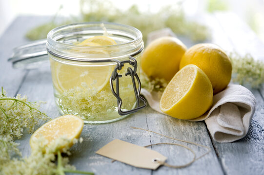 Studio shot of elderflower syrup in mason jar