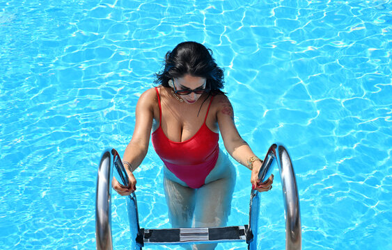 Beautiful woman in the swimming pool