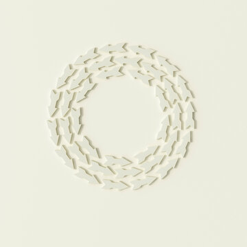 A group of white arrows forms a circle on a plain background