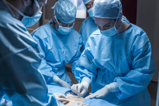 Surgical team preparing patient for operation