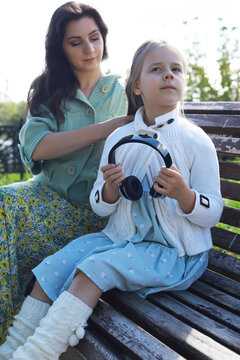 Mother and Daughter Enjoying Outdoor Time: Family Bonding in Nature