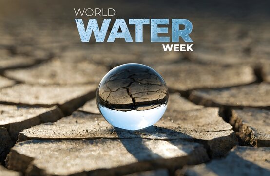Glass water sphere resting on dry cracked earth for world water week