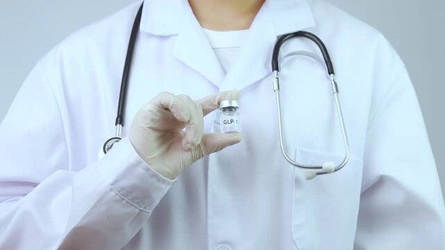 Professional doctor holding weight loss transformation therapy injection pen and medicine vial explains treatment options to hopeful woman patient