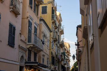 Fototapeta premium Old Corfu town street with traditional buildings and shutters