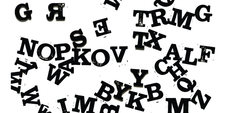 Black alphabet letters scattered randomly in a messy artistic pattern