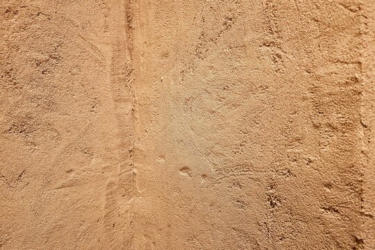 Close up of Traditional Earthen Clay Wall Texture with Natural Earthy Tones.