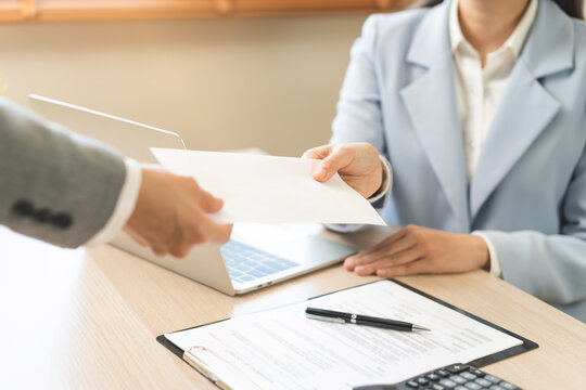 Good job, asian manager business giving financial reward in an envelope, business letter extra salary to company employee, woman worker office hand received premium bonus, getting cheque from her boss