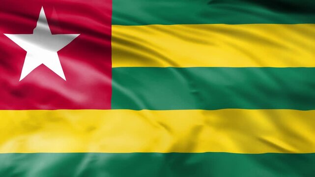 Togo national flag waving in wind showing vibrant colors and fabric texture.