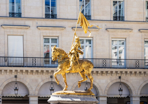 Paris, France - June 17, 2026: Side view of the gilded bronze equestrian statue of Joan of Arc by Emmanuel Fremiet, erected in the Pyramides square in 1874.