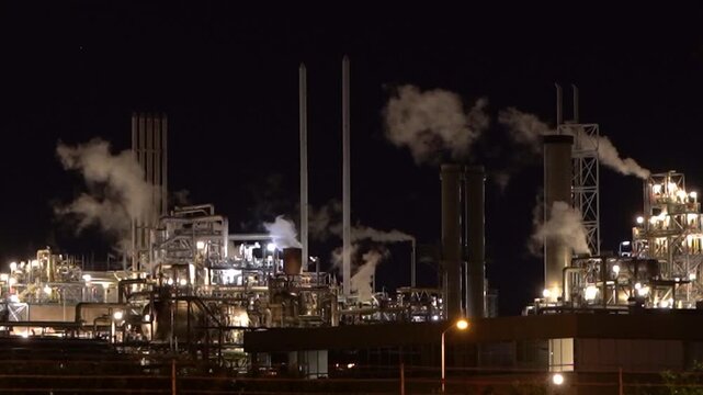 HVC Waste-to-Energy Plant in Dordrecht, Netherlands, Operating at Night with Emissions Visible from Chimneys.