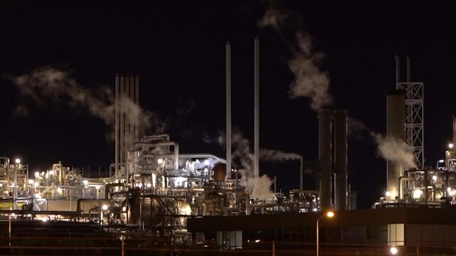 HVC Waste-to-Energy Plant in Dordrecht, Netherlands, Operating at Night with Emissions Visible from Chimneys.