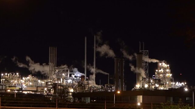 HVC Waste-to-Energy Plant in Dordrecht, Netherlands, Operating at Night with Emissions Visible from Chimneys.
