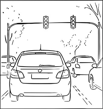 Cars waiting at a traffic light on a city street during the day