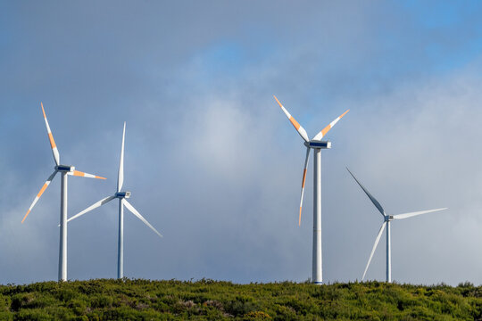 The wheels of a wind turbine are turning on the plateau of Madeira.
