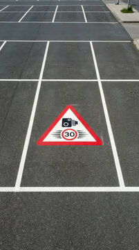 Speed Camera Parking Zone Signage Marked On Asphalt Surface With White Lines
