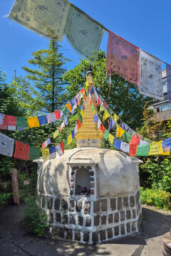 Buddhist stupa and colorful prayer flags in Freetown Christiania in Copenhagen, Denmark