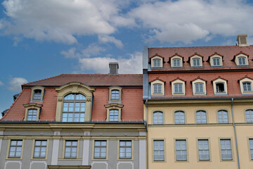 Obraz premium Classic European buildings with red tiled roofs and dormer windows