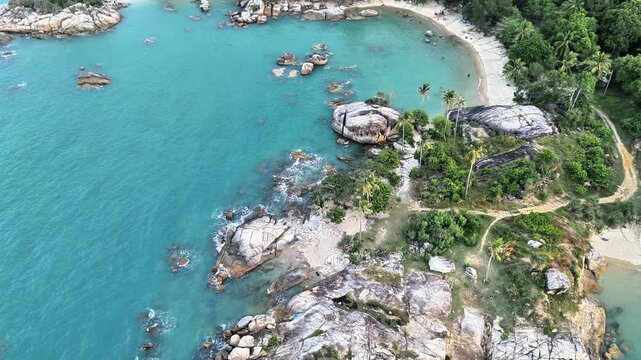 Aerial Drone View of Teluk Karang Beach Bangka Showcasing Granite Coastline, Turquoise Ocean and Tropical Paradise for Holiday Escape Bliss