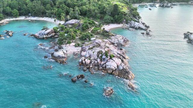 Aerial Drone View of Teluk Karang Beach Bangka Showcasing Granite Coastline, Turquoise Ocean and Tropical Paradise for Holiday Escape Bliss