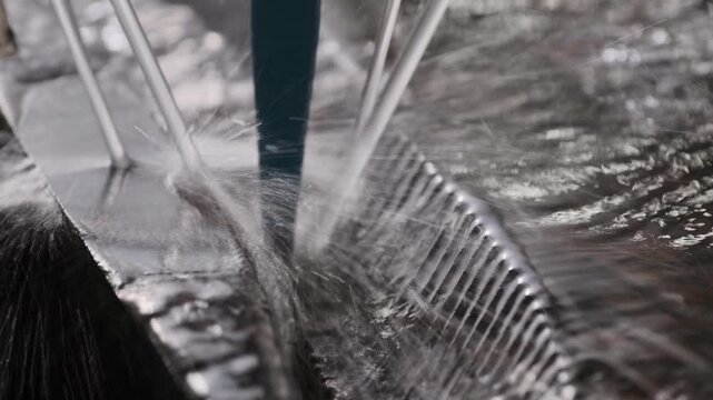 CNC machine with a diamond drill bit carves patterns into a slab of granite, showcasing the precision and artistry of modern manufacturing