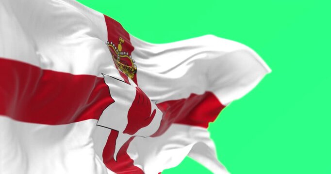 Northern Ireland flag waving in the wind isolated on green background