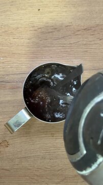 Pouring hot water for instant coffee preparation