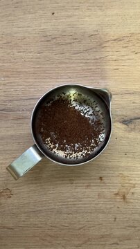 Person making instant coffee top view
