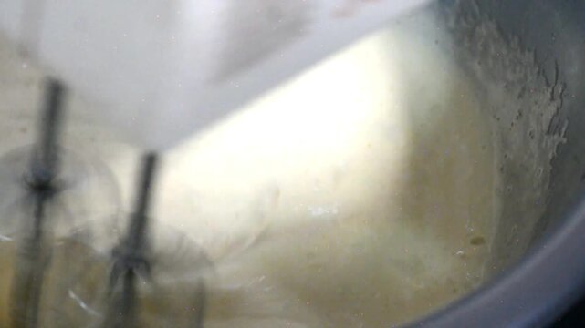 Whisking Eggs to Prepare Homemade Cake Batter for a Tart