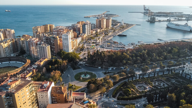 Aerial view of Malaga waterfront with harbor marina and Mediterranean coastline, Spanish coastal city skyline with cruise port seaside boulevard and urban landscape from drone