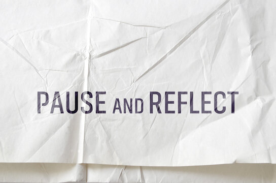 Pause and reflect sign on white background