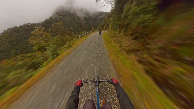 Mountain Biker Riding the Death Road in Bolivia