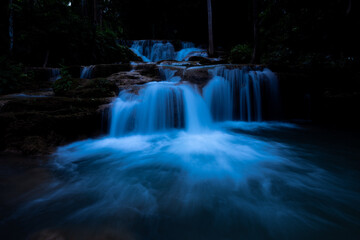 Cascading Water Flows Over Tiered Limestone Rocks At Huai Mae Khamin Waterfall In Kanchanaburi Thailand © SHUTTER DIN